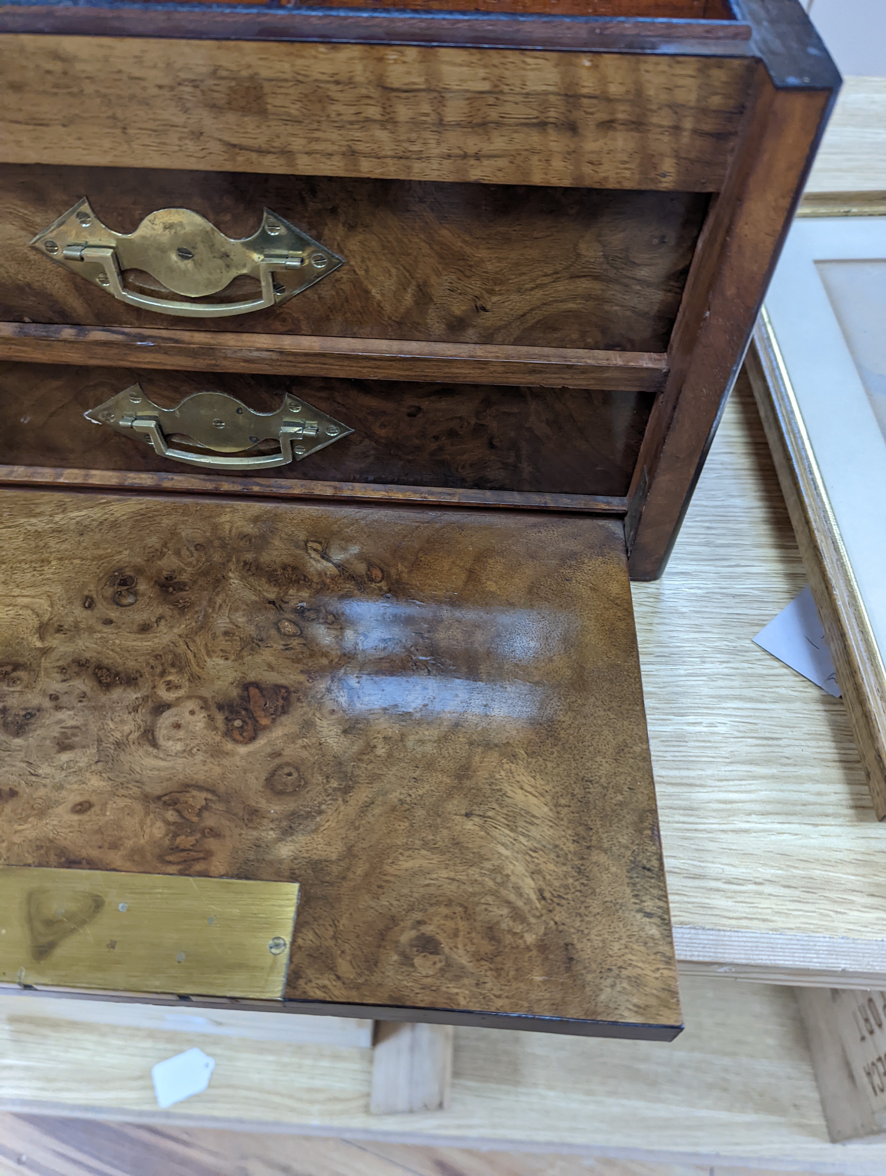 A Victorian walnut sewing casket, 34cm, containing sewing related accessories